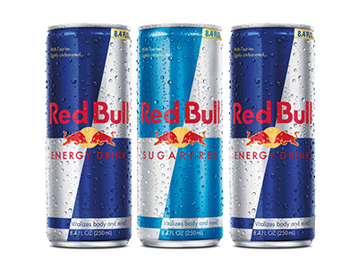 A photo of three Red Bull cans